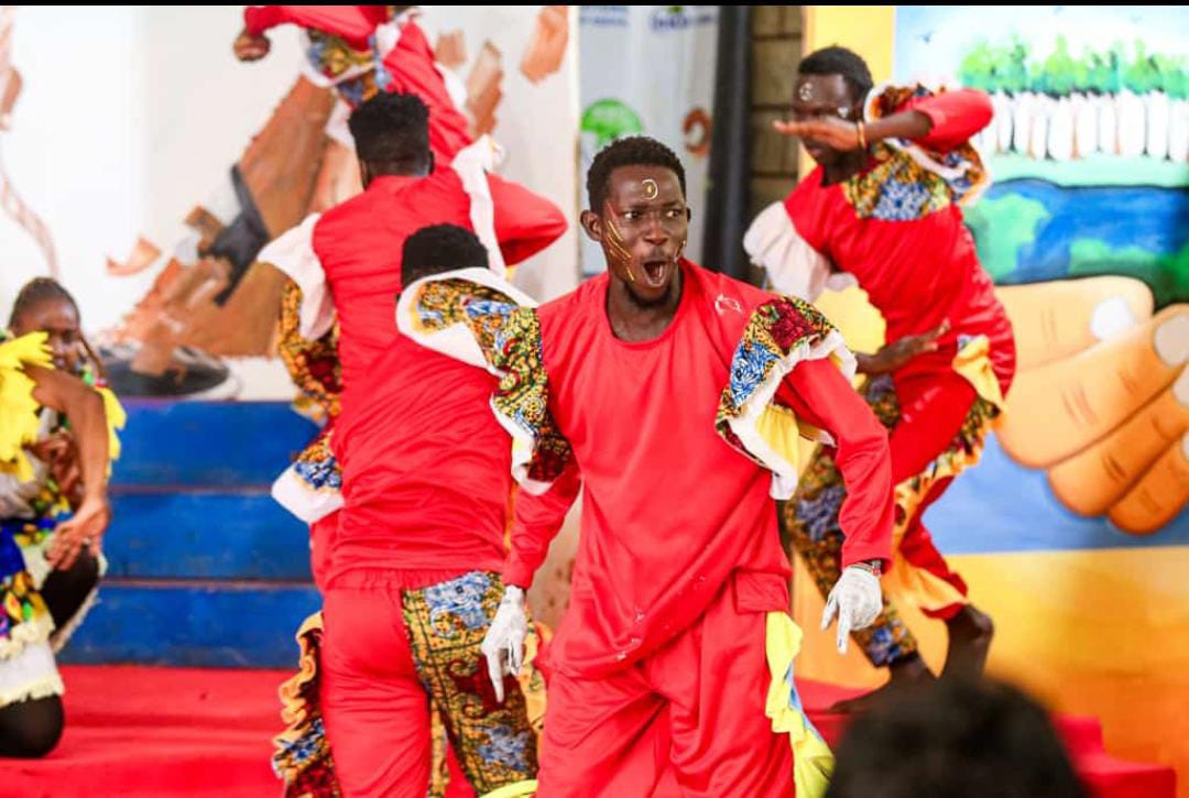 Teachers and children in a training workshop